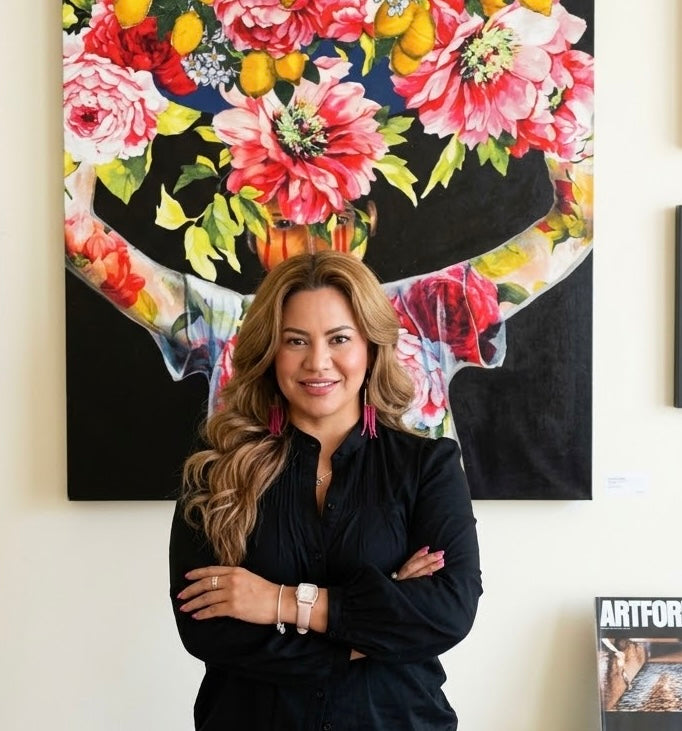 Karina Barahona in front of her floral portrait painting at an exhibition